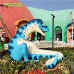 Estàtua de dinosaure de dibuixos animats